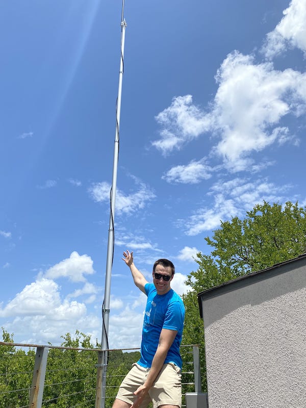 Me, standing next to a tall antenna