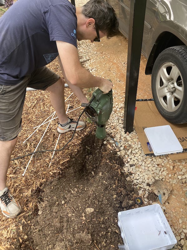 A guy digging with a jackhammer